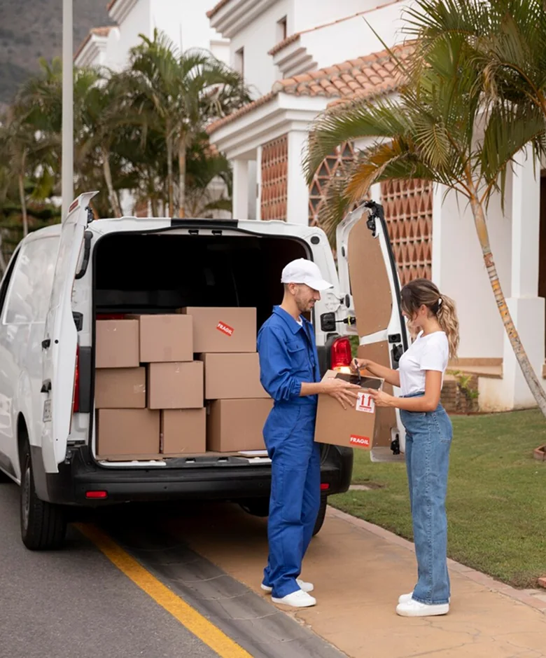 A CBD Movers removalist loading a large box into the back of a moving van