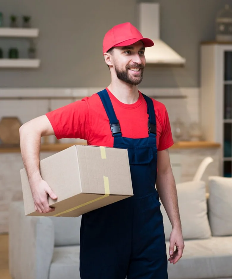 A CBD Movers removalist loading a large box into the back of a moving van